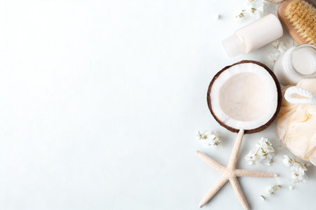A half coconut on a stick, resembling a lollipop, surrounded by natural, tropical-themed elements on a light background.の写真素材