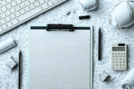 A clean and organized desk setup with essential office supplies arranged neatly for productivity.の写真素材