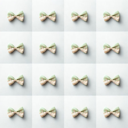 A grid of sixteen small, cream-colored fabric bows, each with a slightly different texture and shadow, presented on a white background.の写真素材