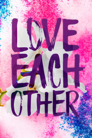 A powerful message of unity and affection displayed in bold purple lettering against a colorful,...