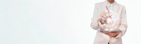 A woman stands gracefully in a detailed white kimono adorned with subtle floral patterns and shimmering embellishments.の写真素材