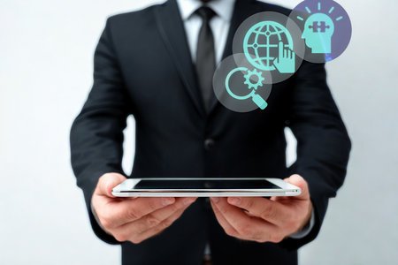 A man in a suit holds a tablet displaying glowing icons of a globe, magnifying glass, and lightbulb, symbolizing business ideas and global reach.の写真素材