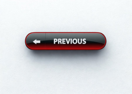 A single, glossy, oval-shaped button with a red border and black background. The word PREVIOUS and a white left arrow are printed on its surface.の写真素材