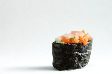 A single piece of salmon gunkan maki sushi with a white background. The seaweed wrap is dark and textured.の写真素材