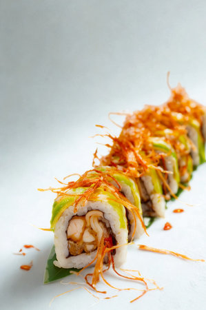 A close-up shot of a freshly made sushi roll.の写真素材