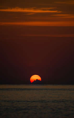Beautiful sunset over the sea. The sun goes down over the sea.