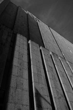 A vertical shot of the facade of a building in black and whiteの写真素材