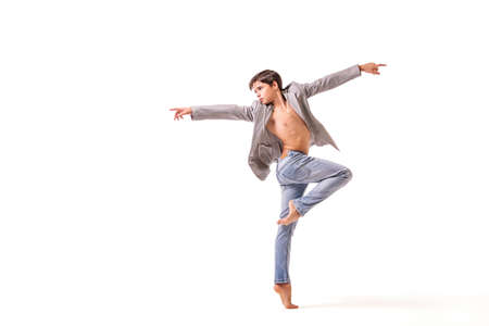 teenage ballet dancer poses barefoot, isolated on white background.の写真素材