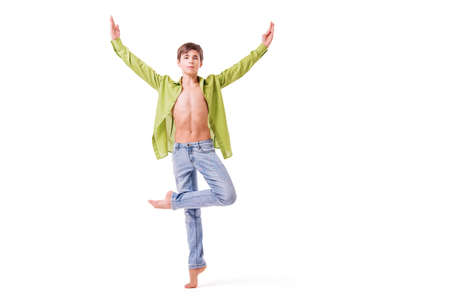 teenage ballet dancer poses barefoot, isolated on white background.の写真素材