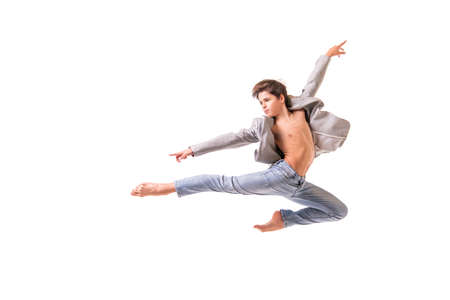 Ballet dancer teenage boy jumping barefoot, isolate on a white background.の写真素材