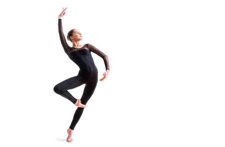 ballet girl in a black tight-fitting suit dances on white background with modern contemporary choreographyの写真素材