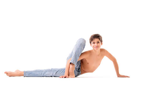teenage ballet dancer poses barefoot, isolated on white background.の写真素材