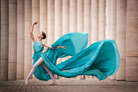 dancer in flying emerald dressの写真素材