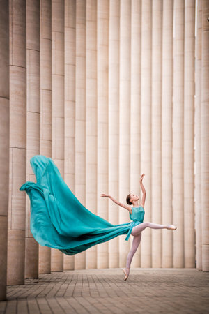 dancer in flying emerald dressの写真素材