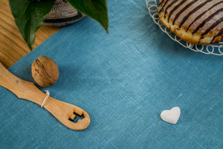 Sweet buns, a walnut and a sugar heart on blueの写真素材