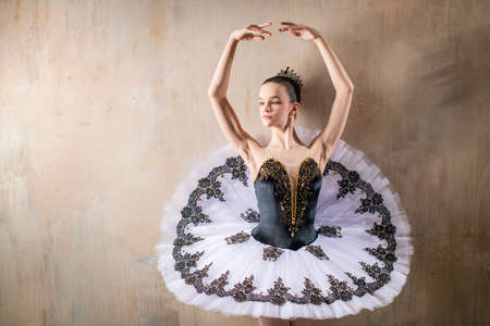 Portrait of a young ballerina in a white tutu posingの写真素材