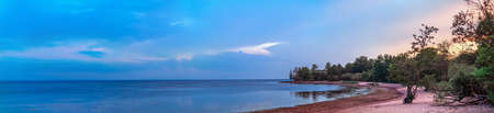 Panoramic view of the coast of the Gulf of Finland at sunset, Kotlin island, Russiaの写真素材