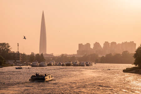 Russia, St. Peterburg. View of the Gazprom tower, anchorage of yachts and boats at the mouth of the Neva River during sunset.のeditorial素材