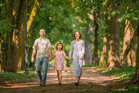 Portrait of a happy traditional family on a walk in a summer parkの写真素材