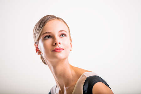 Portrait of beautiful young girl with clean skin on pretty face - white backgroundの写真素材