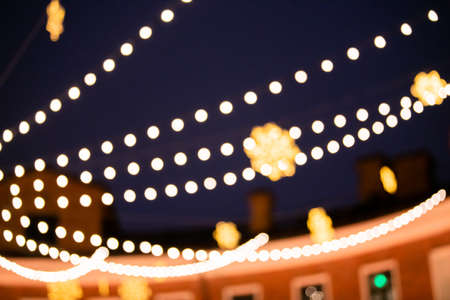 Abstract blurred background with colorful bokeh circles. Urban lifestyle background of street lights...