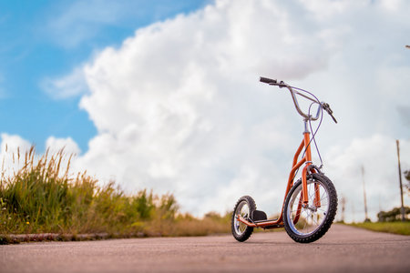 modern light scooter. Road in nature. concept of eco-friendly movement.の写真素材