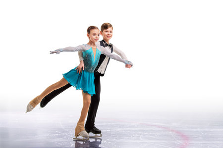 Young figure skaters in elegant ice dance - sports couples at competition, isolated on white background.の写真素材