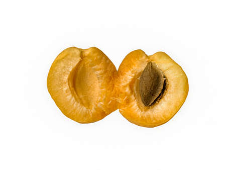 Apricot on a white background. isolated apricot open fruit with stoneの写真素材