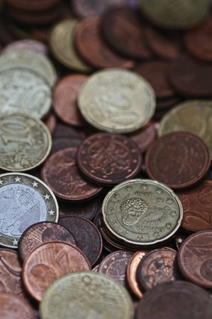 Coins of different countries. Selective focus and shallow depth of field.