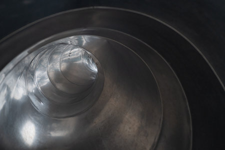 Close-up of a stainless steel drum in a factory, stock photoの写真素材