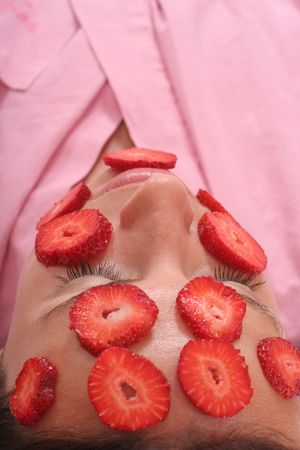 young woman with a Strawberry maskの写真素材