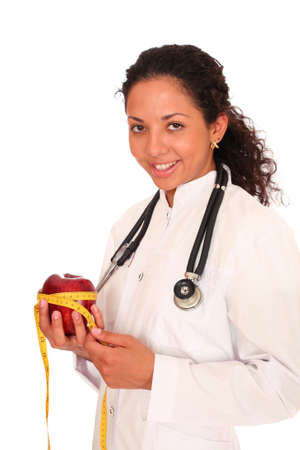 Young doctor with a red appleの写真素材