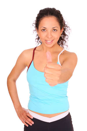 Happy sportswoman show OK by the hand over white background. の写真素材