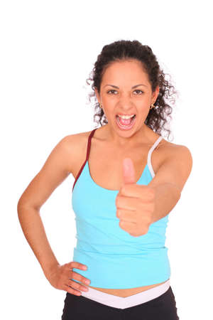 Happy sportswoman show OK by the hand over white background.の写真素材