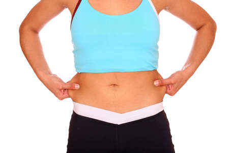 Woman's abdomen over white backgroundの写真素材