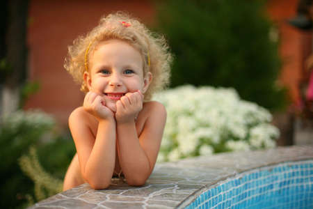 A little smiling girl looking at the cameraの写真素材