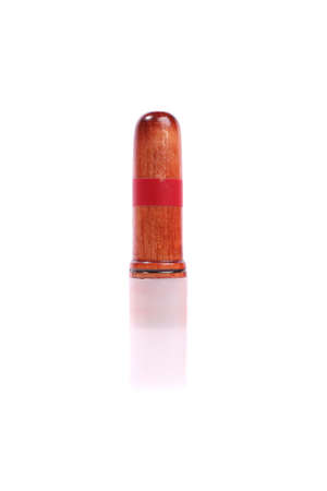 A hunter's whistle standing over white background