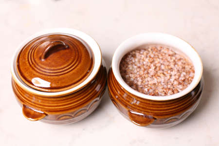 Two pots with boiled buckwheatの写真素材