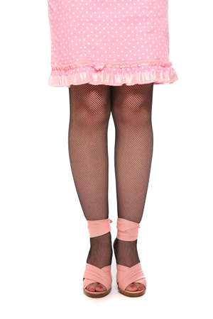 women legs in pink sandals  over white backgroundの写真素材