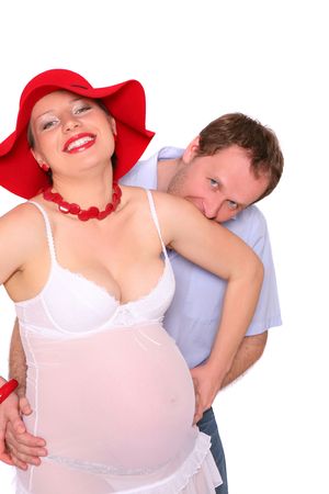 Attractive pregnant woman with her husband over white backgroundの写真素材