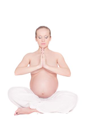 pregnant woman doing exercise over white backgroundの写真素材