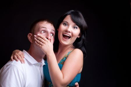 Happy couple over black backgroundの写真素材