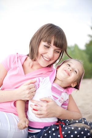 Portrait of happy young mother and daughter.の写真素材