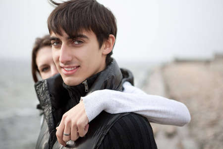 Handsome georgian man is standing with his girlfriend in outdoorsの写真素材