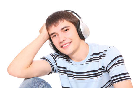 Man is listening to the music over white backgroundの写真素材