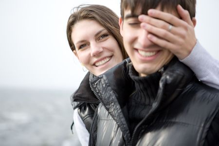 An attractive young woman embracing her handsome boyfriendの写真素材