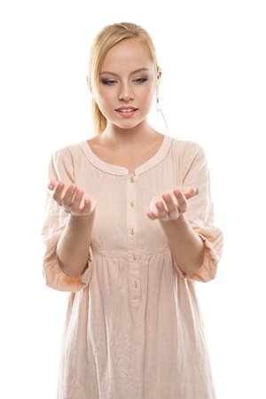 Pretty girl with a headset is holding something over white backgroundの写真素材
