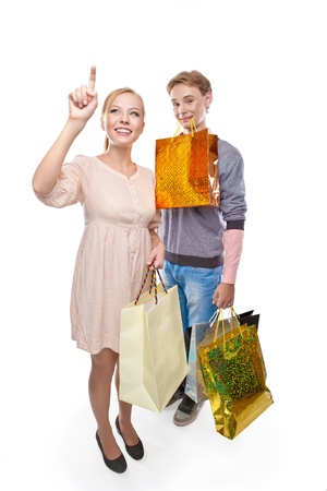 Happy woman and  man is holding paper bags over white backgroundの写真素材