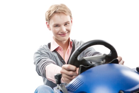Smiling guy is using a joystick for game over white backgroundの写真素材