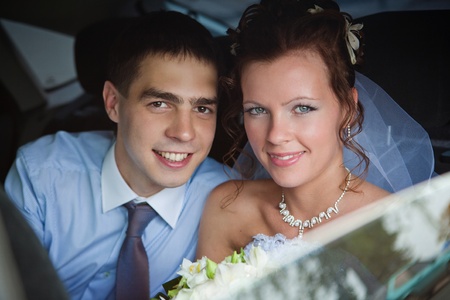 Portrait of a newlywed couple in a carの写真素材